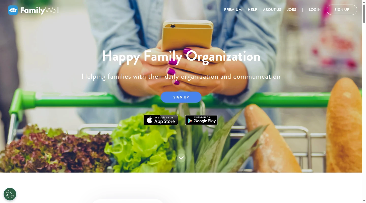 FamilyWall homepage showing a parent using a phone while pushing a grocery cart.